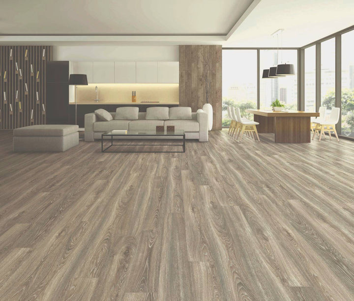 Modern living room with wooden flooring, furniture, and large windows.