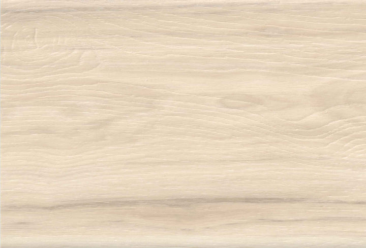 A close-up texture of a light beige wood grain surface with subtle wavy lines and natural tonal variation.