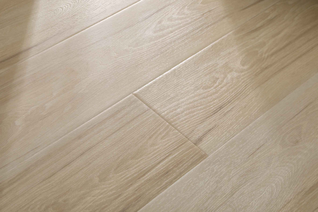 Light beige wood-look flooring planks with a natural grain pattern, shown in a close-up view.
