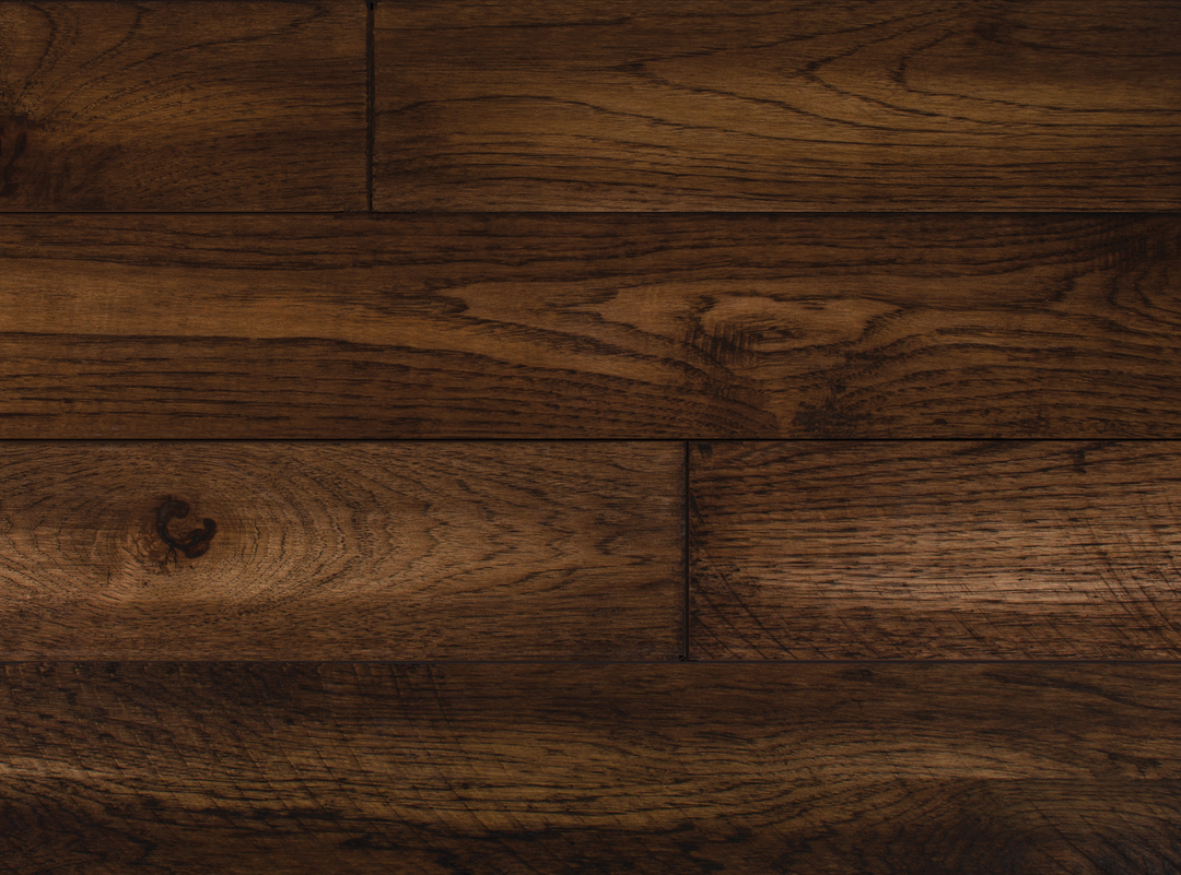 Dark brown hardwood flooring planks with prominent natural grain patterns and knots.