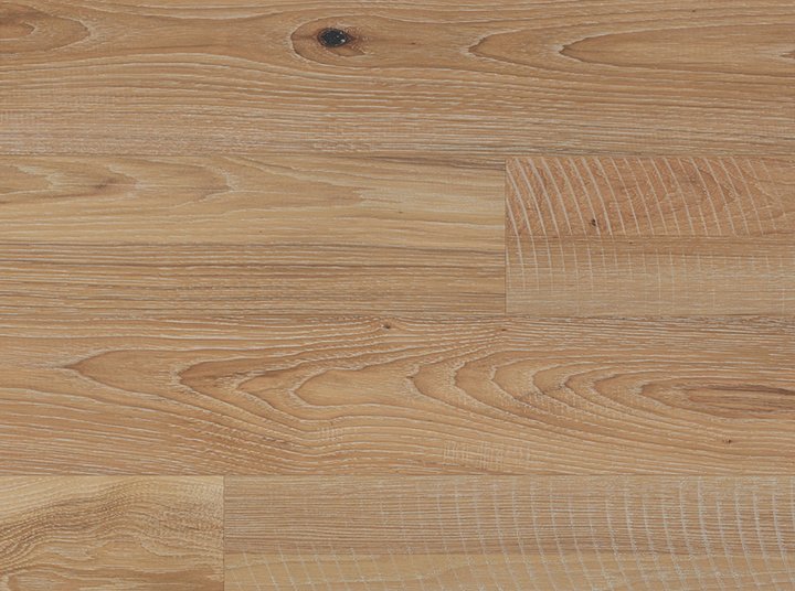 Light natural wood flooring planks with visible grain patterns and a small dark knot near the top center.