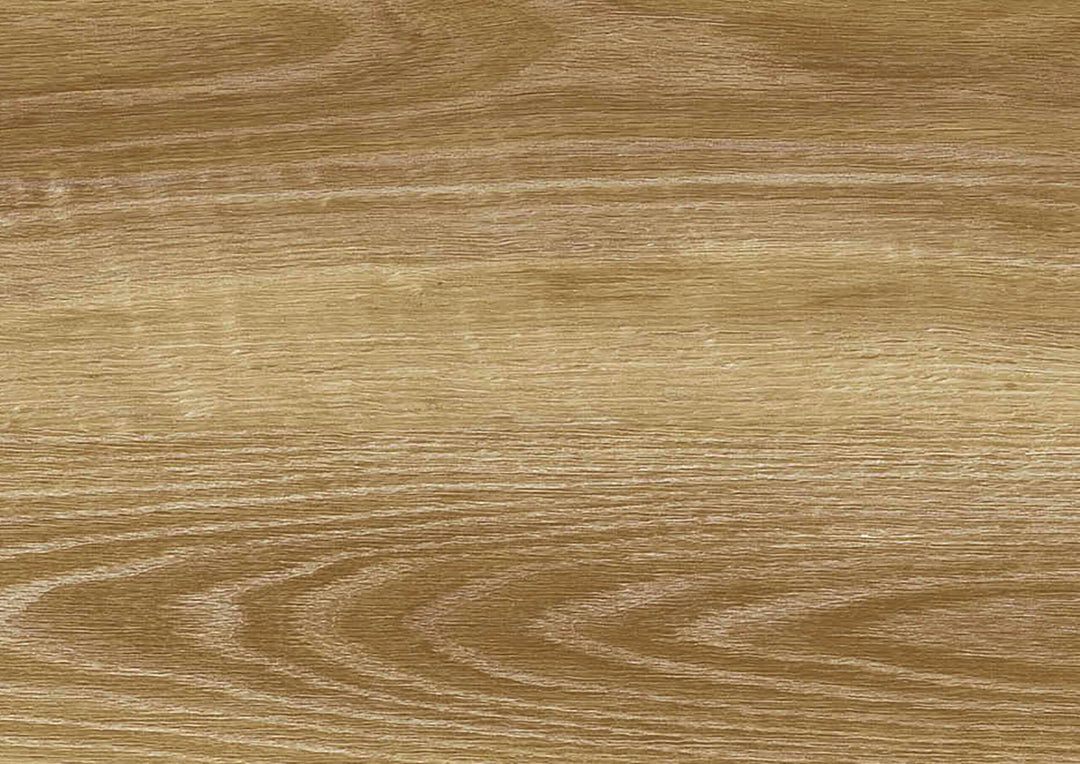 A close-up texture of a light brown wood grain surface with natural wavy lines and a smooth finish.