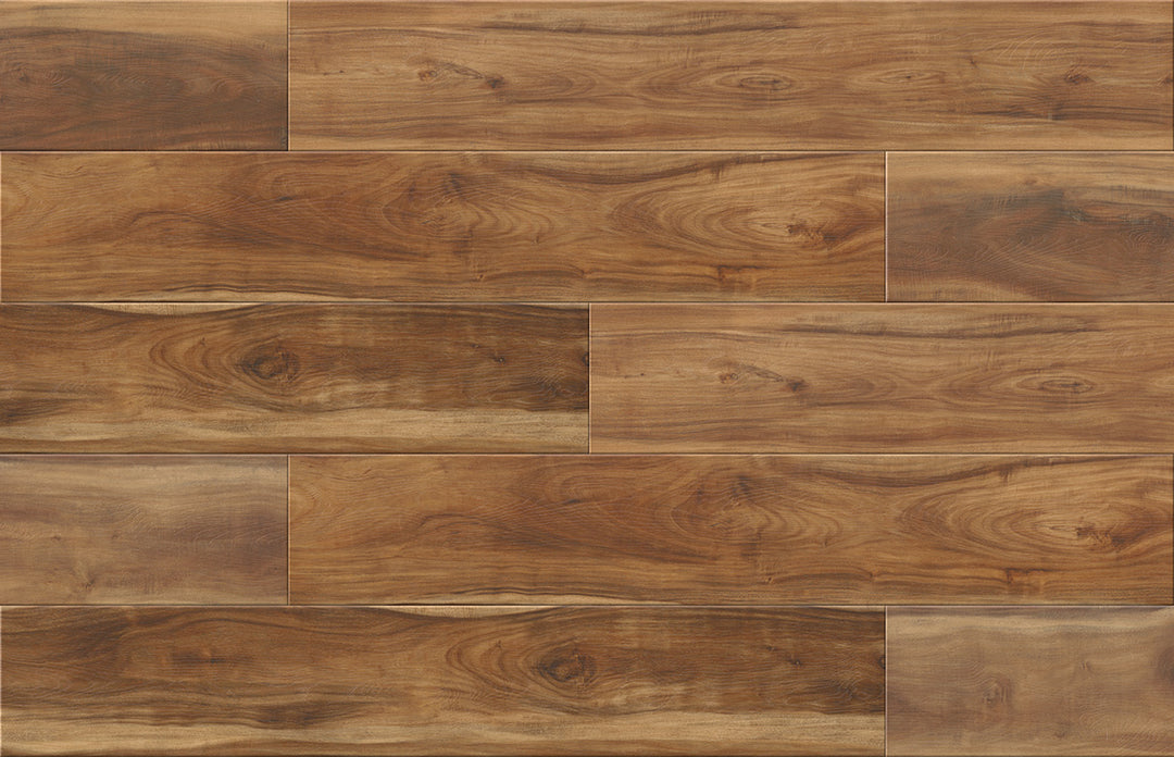 Brown wood plank flooring with varied grain patterns and natural knots, arranged in a staggered brick layout.