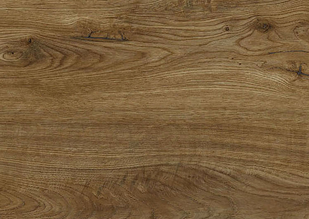 A close-up view of a wood grain surface with natural brown tones, visible knots, and swirling grain patterns.