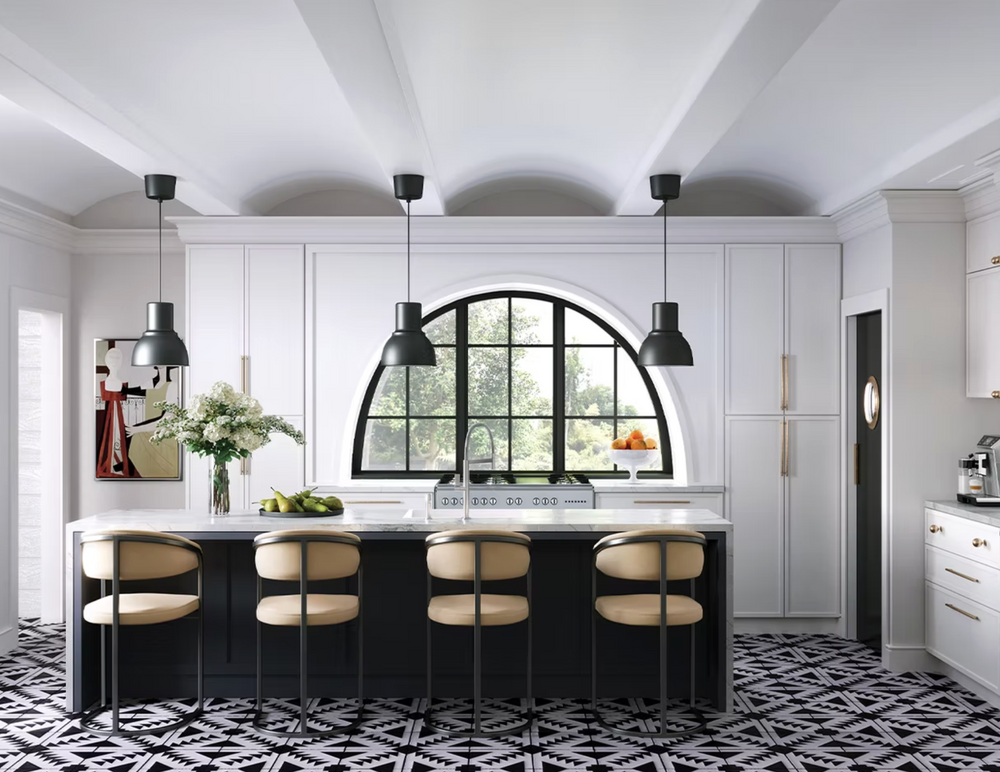 Modern kitchen with black island, white cabinets, and decorative mirror.