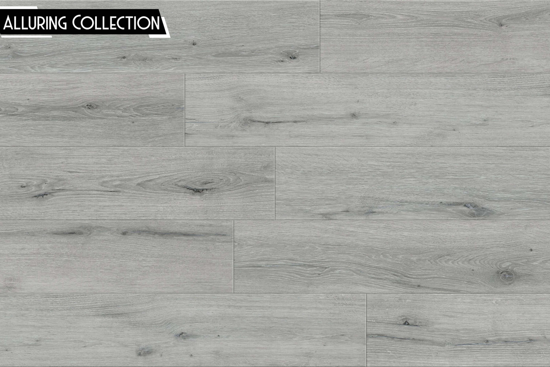 Light gray wood-look flooring planks with visible grain, knots, and plank seams, shown as a surface sample. A black label in the top-left corner reads 'ALLURING COLLECTION'.