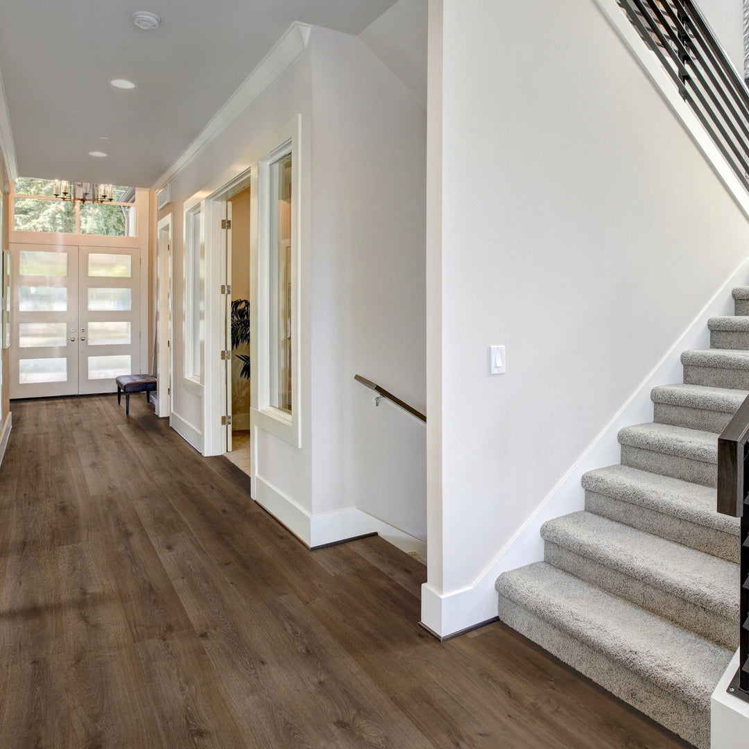 timbrcore-sequoia-altasierra-flooring in a hallway with carpeted stairs